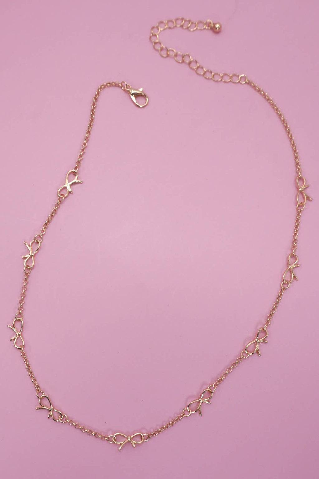 CUTOUT BOW STATION NECKLACE